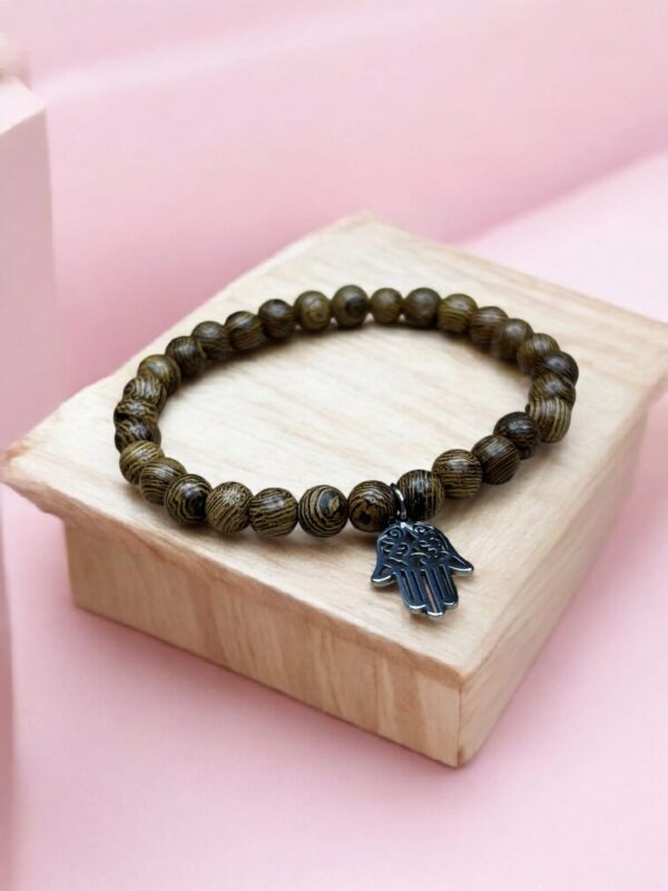 PULSERA PALO SANTO CON DIJE MANO DE FATIMA