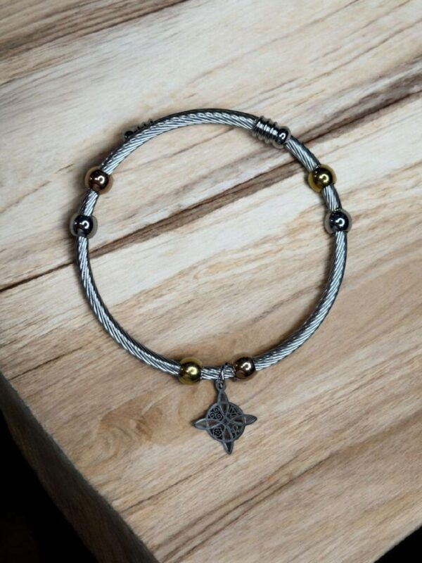 PULSERA ACERO BICOLOR CON DIJE NUDO DE BRUJAS