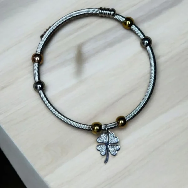 PULSERA ACERO BICOLOR CON DIJE TRÉBOL DE LA SUERTE
